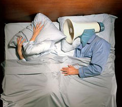 picture of a megaphone sleeping next to a woman in bed